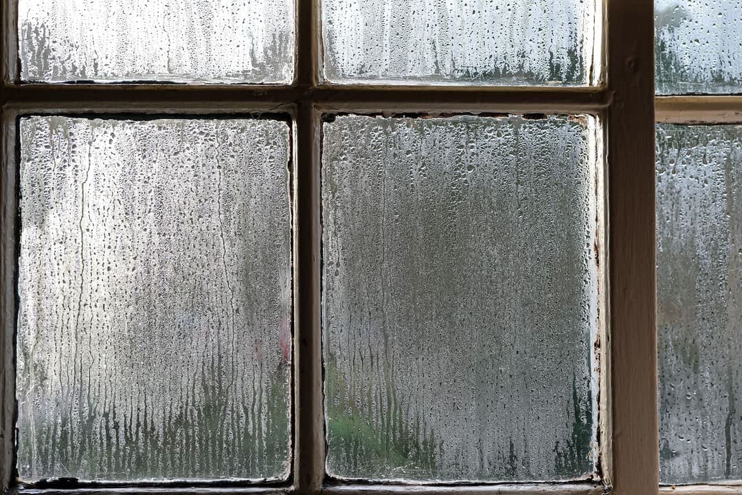 Foggy window glass with condensation between panes